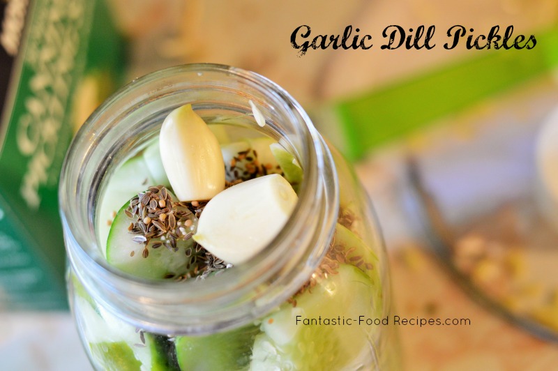 Adding seasoning to Garlic Dill Pickles